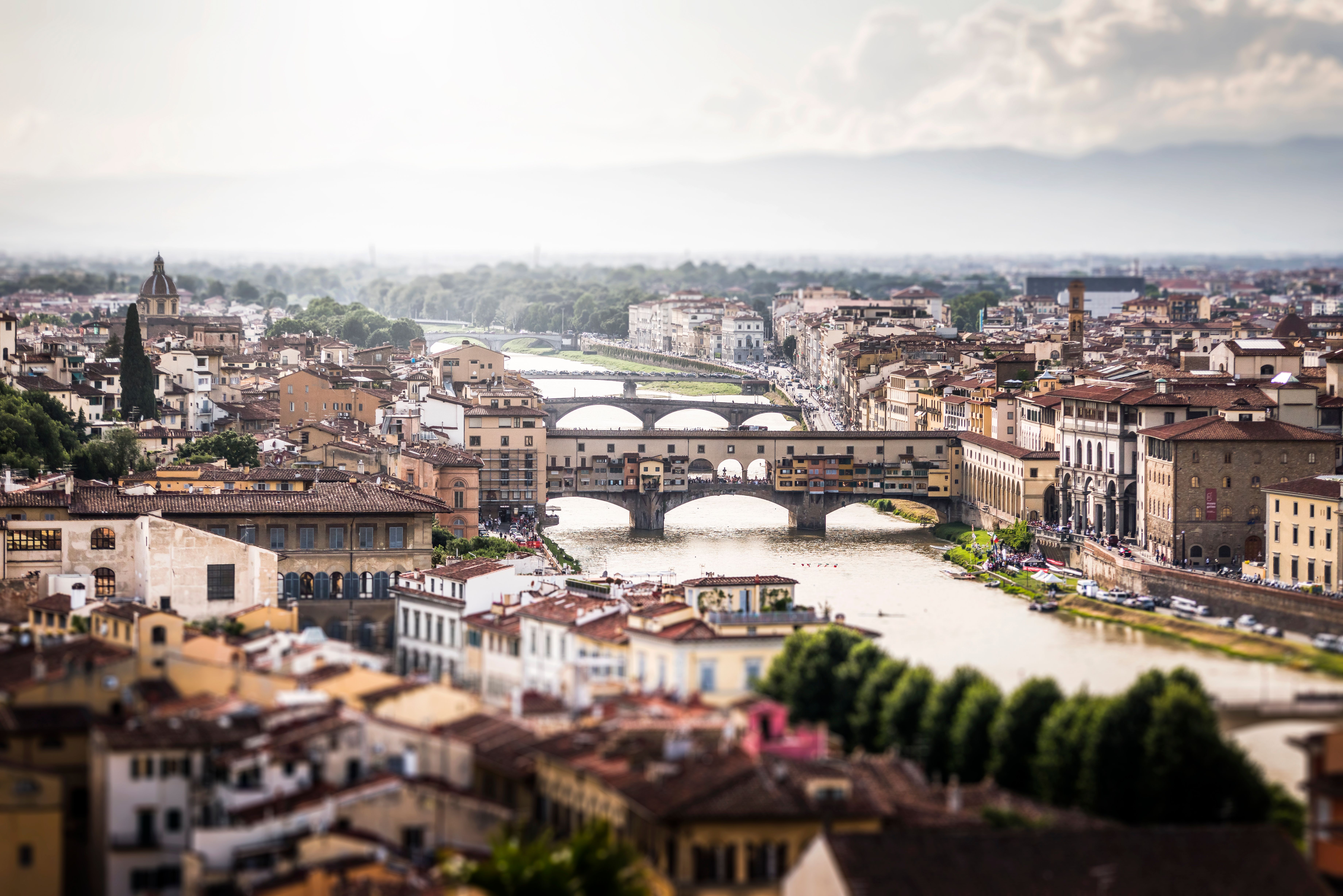 A low-angle view of cobblestone streets lining a historic city's architecture.