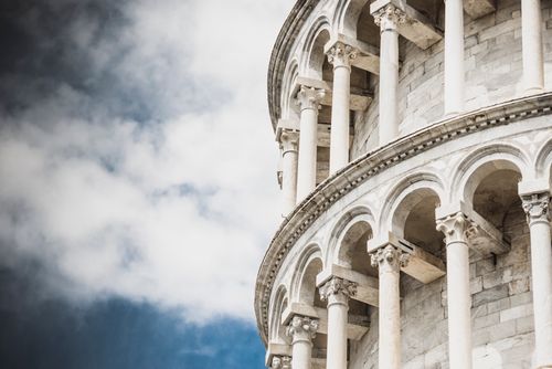 Free Close-up of the iconic Leaning Tower of Pisa showcasing its architectural details and columns. Stock Photo