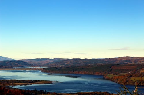 Free Scenic View of Scottish Highlands near the River Stock Photo