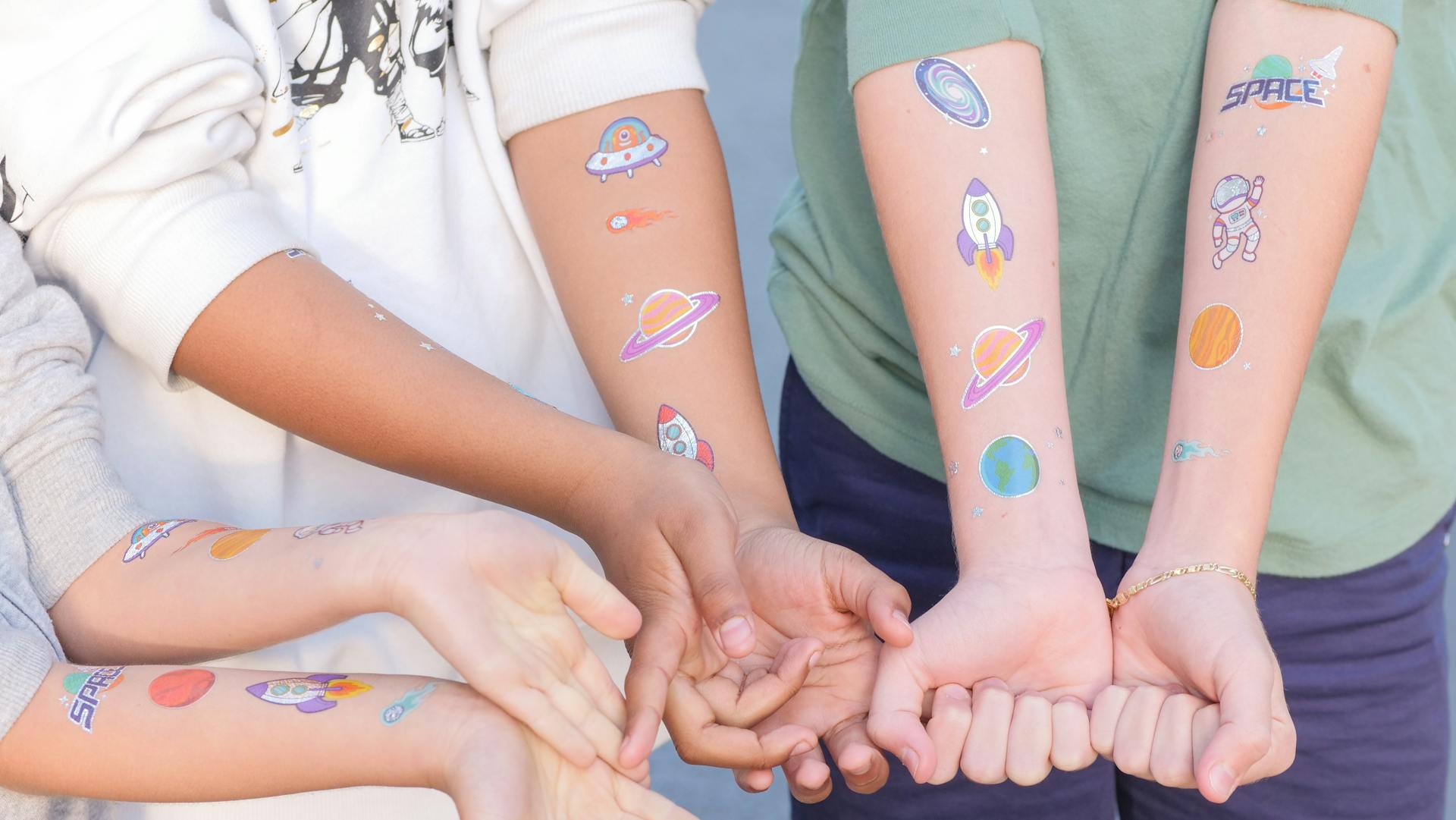 Children with Temporary Tattoos on their Arms