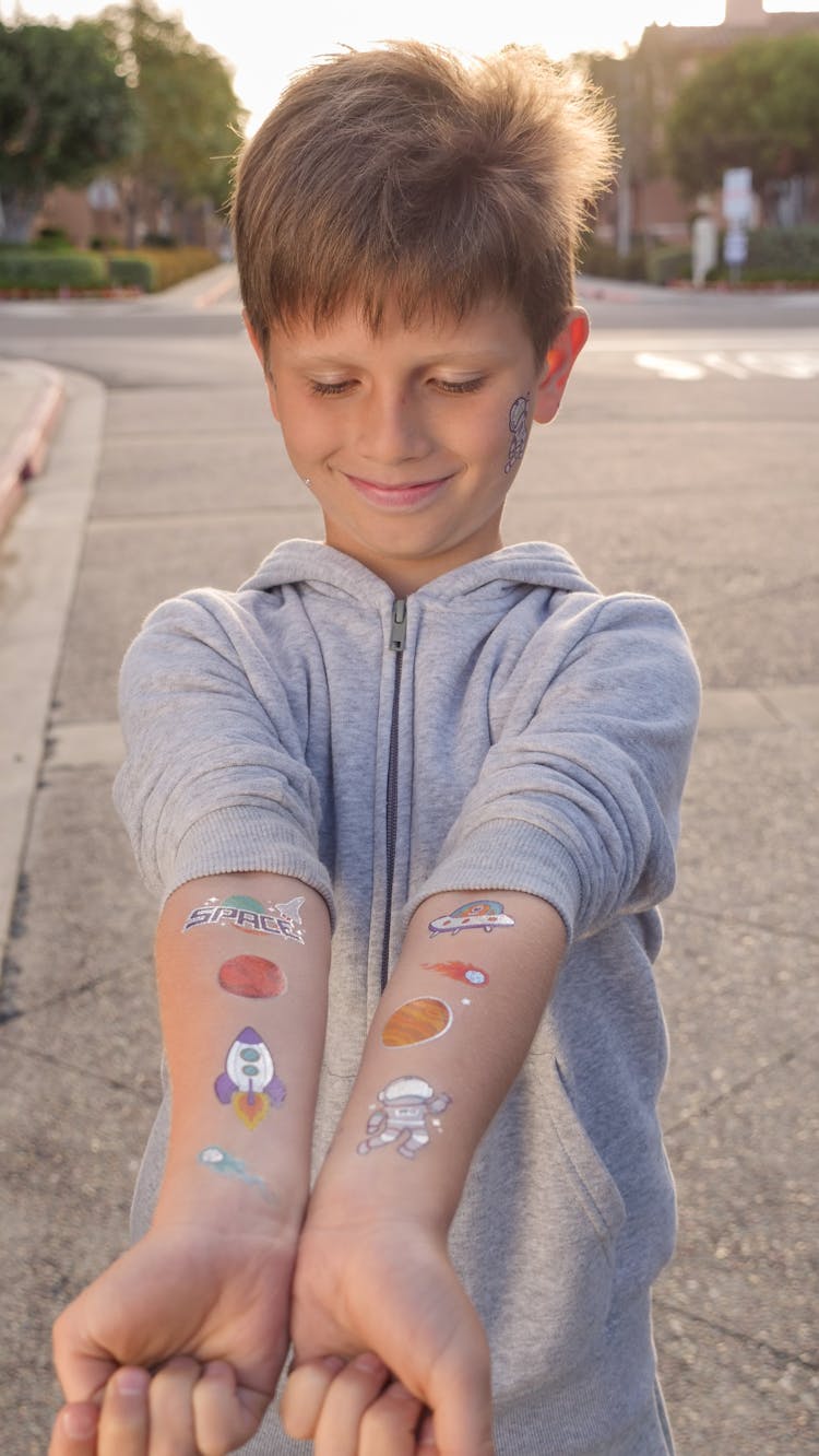 Boy In Gray Jacket Showing Body Paint