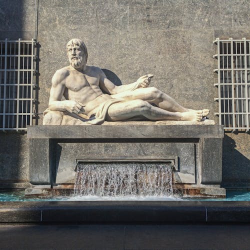 Fountain under my a Sculpture of a Man