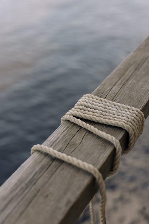 Close-Up Shot of a Rope on a Wooden Post