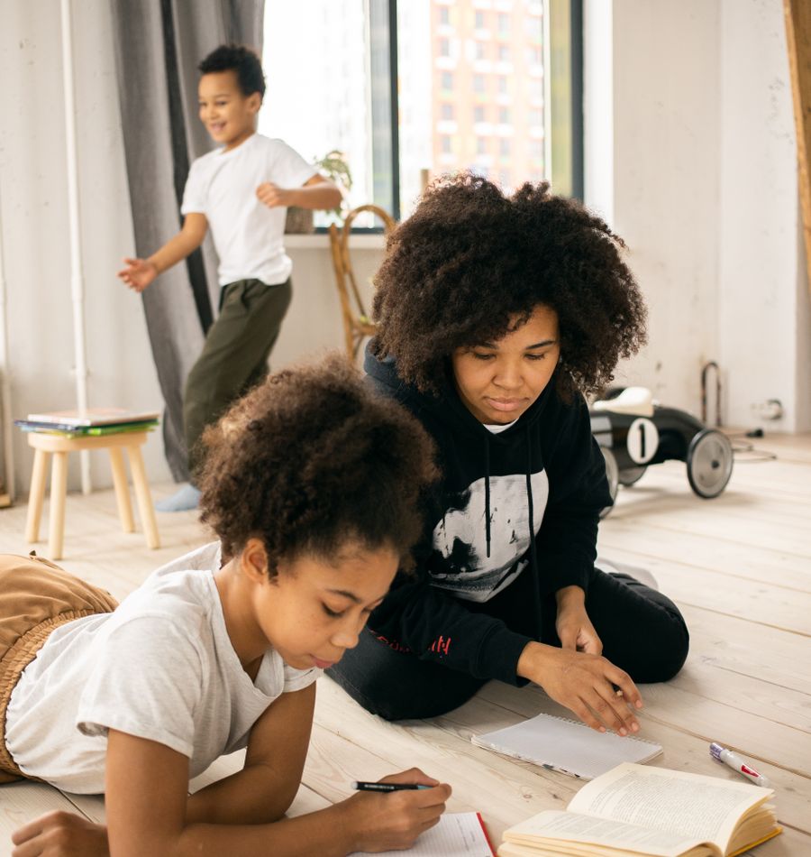 A parent and child learning together at home