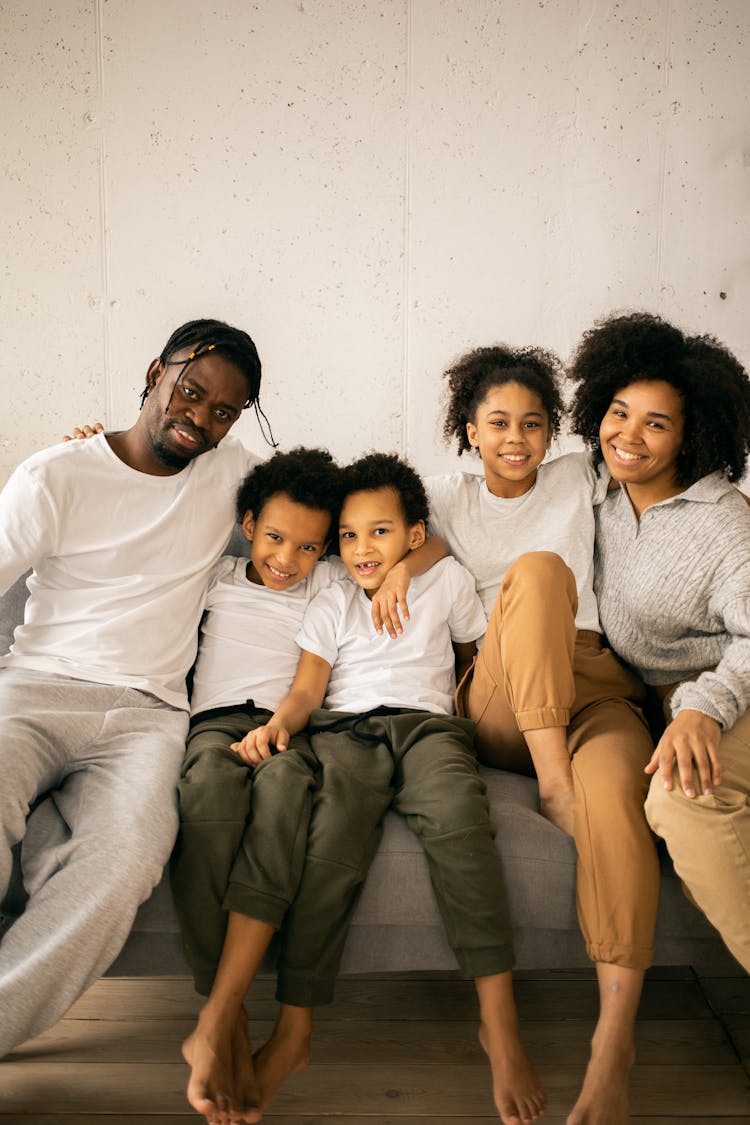 Content Black Family On Sofa