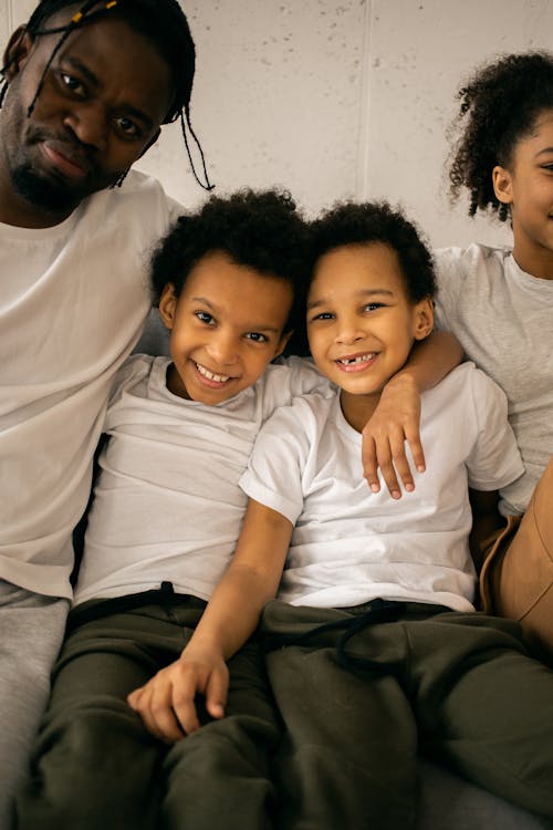 Free Happy father with children in room Stock Photo