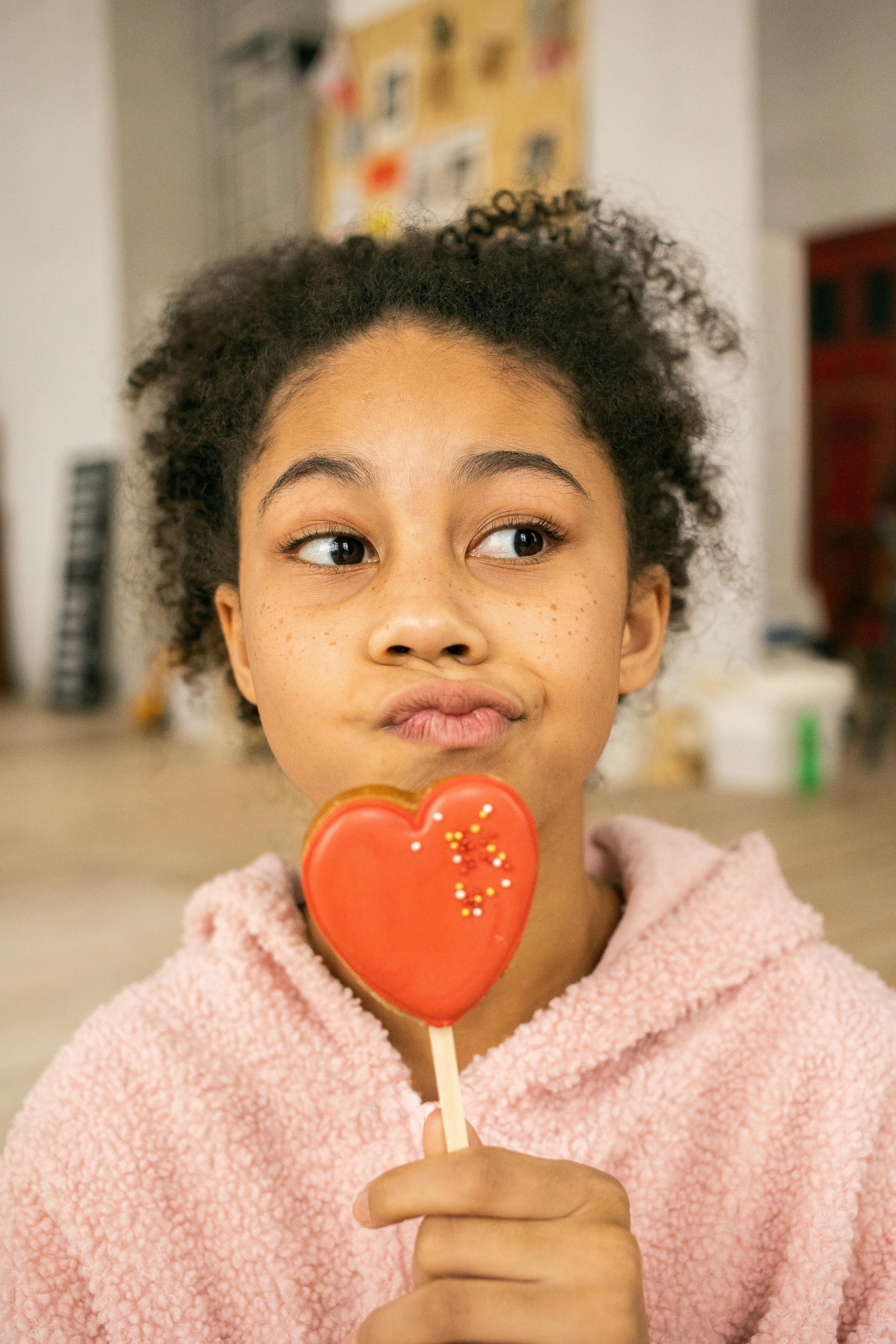 cute black girl with heart shaped gingerbread cookie