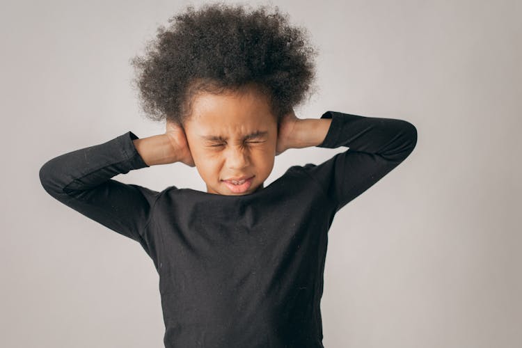 Stressed Black Girl Covering Ears