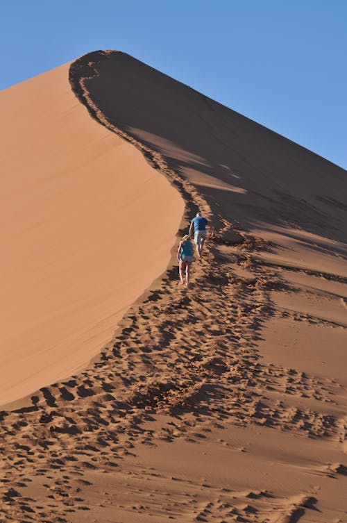 People Walking on Sand Dune