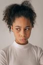 Worried black girl near wall