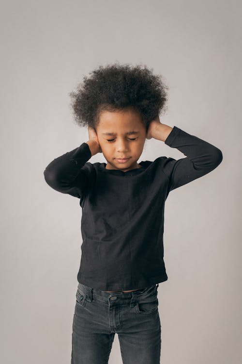 Free Hopeless black girl covering ears Stock Photo