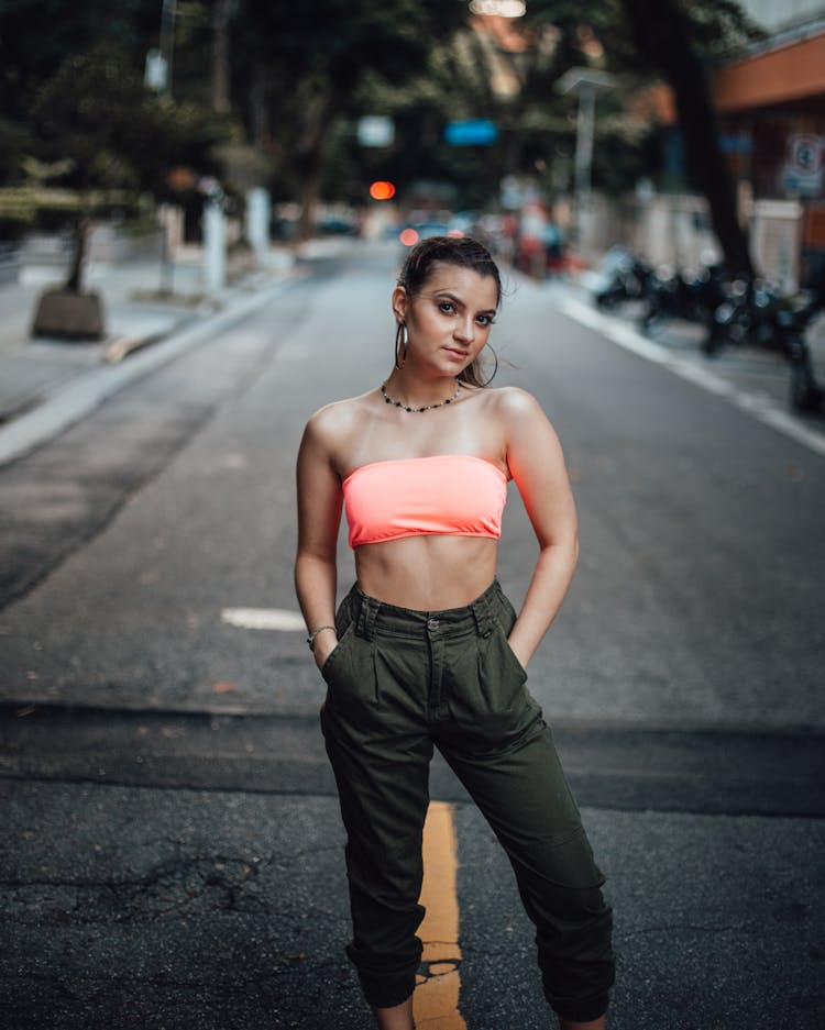 Model Girl Wearing Crop Top Standing In Middle Of Road