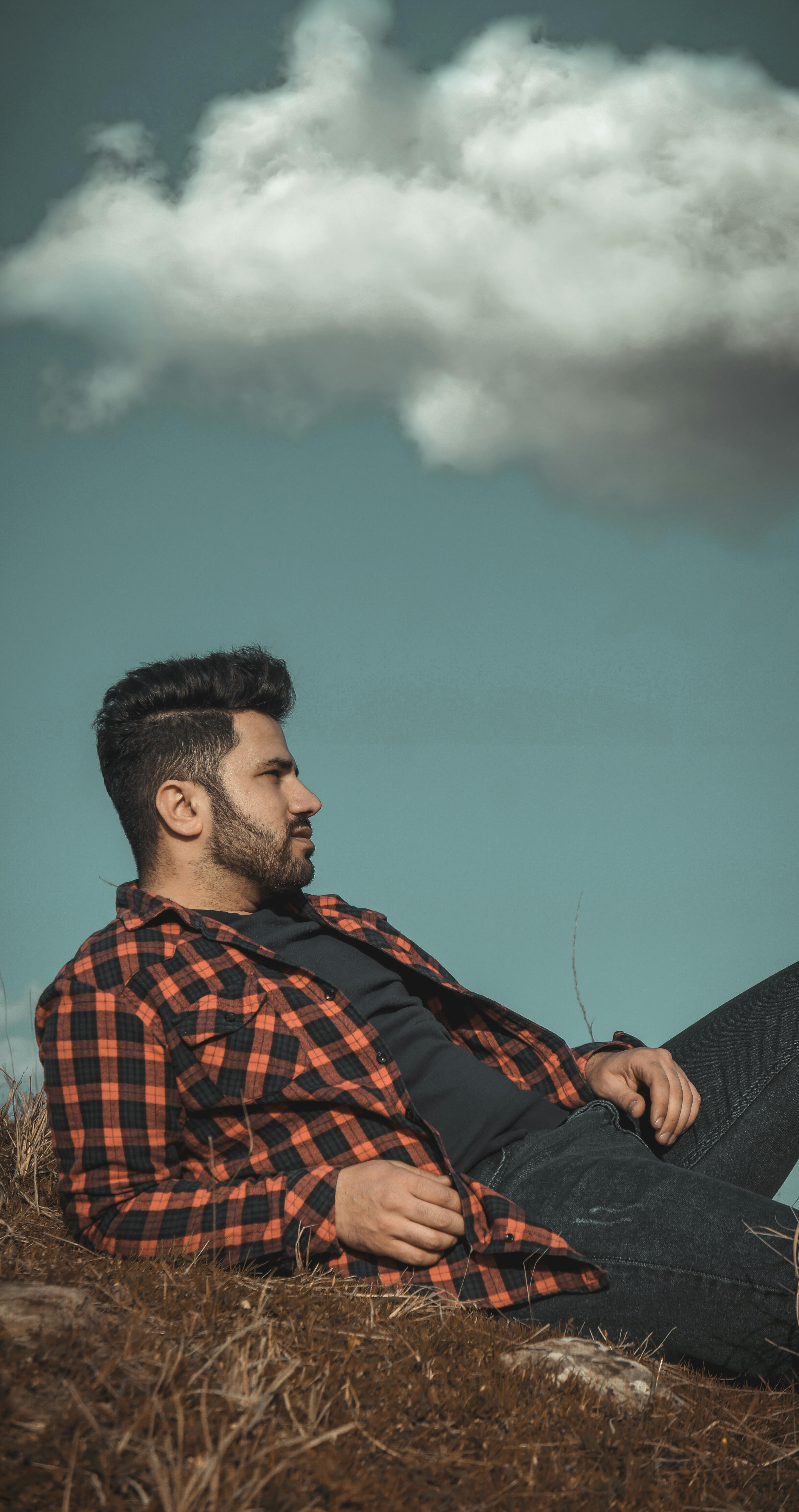 Stylish Man sitting on Concrete Bleachers · Free Stock Photo