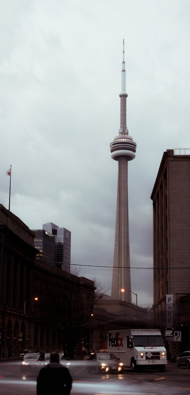 Tall CN Tower In City With Cars