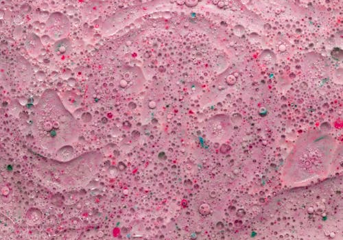 Close-up Photo of Pink Water Bubbles