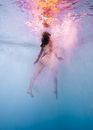 A Woman Striding Underwater