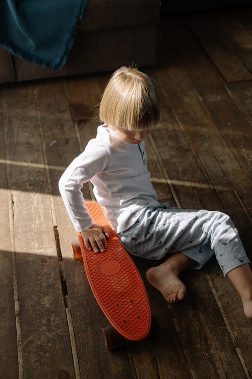 A Boy Playing Penny Board