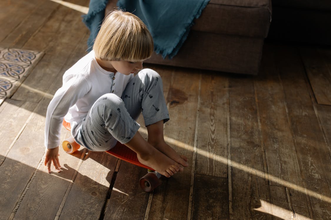 A Boy Riding on a Penny Board