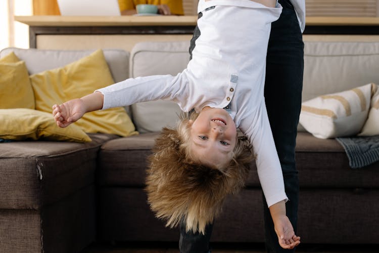 A Kid Hanging Upside Down