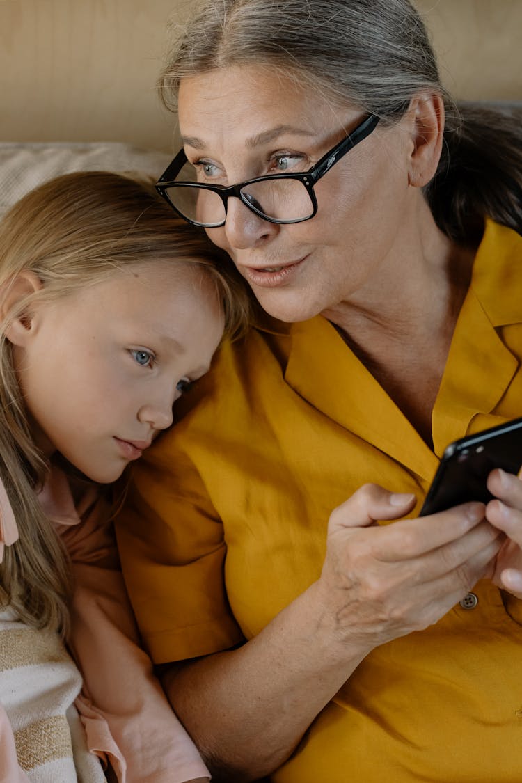 Girl Leaning On Her Grandmother