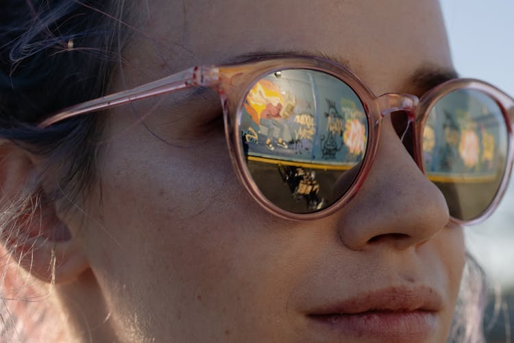 Close Up Photo Of A Woman Wearing Sunglasses