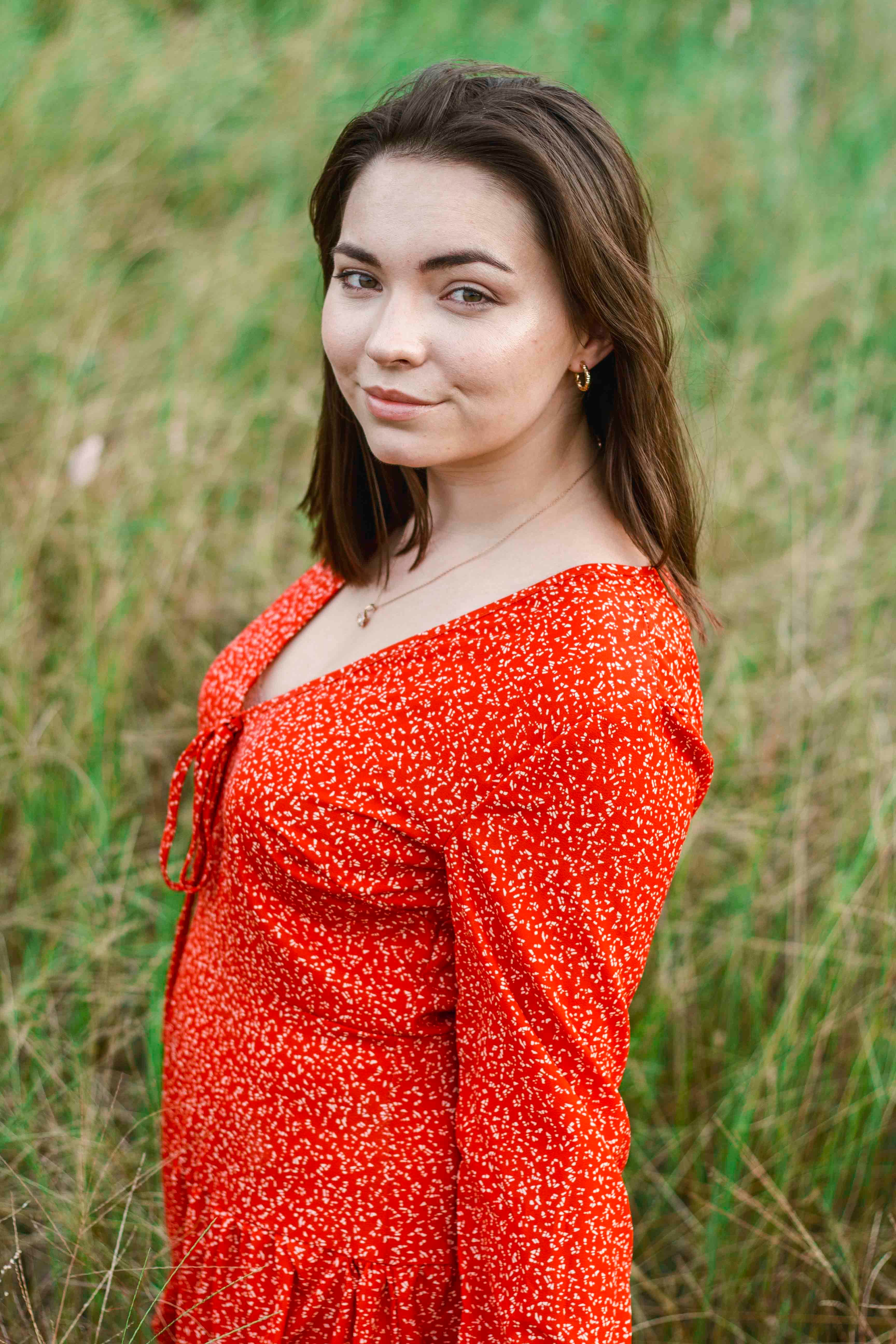 Woman in Red Dress Smiling · Free Stock Photo
