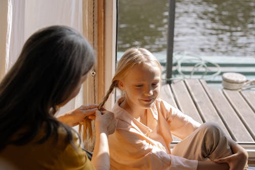 Free Girl Getting her Braided Stock Photo