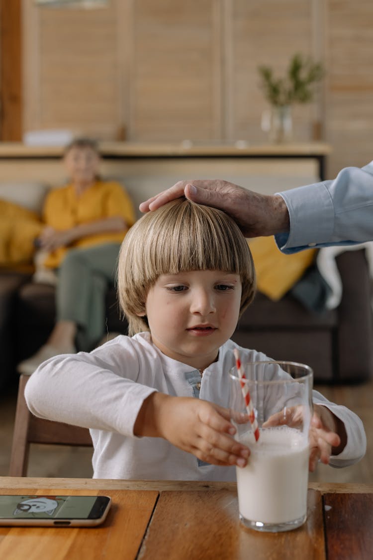 Boy Holding A Glass Of Milk