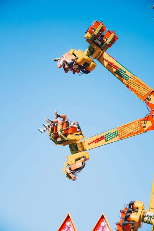 Free Photograph of People Riding an Amusement Park Ride Stock Photo