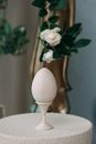 White Flower on White Ceramic Vase