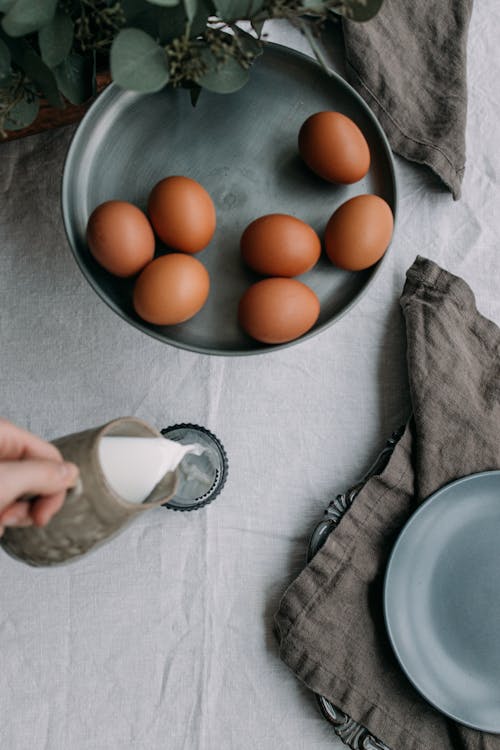Kostnadsfri bild av bordsservetter, bruna ägg, häller