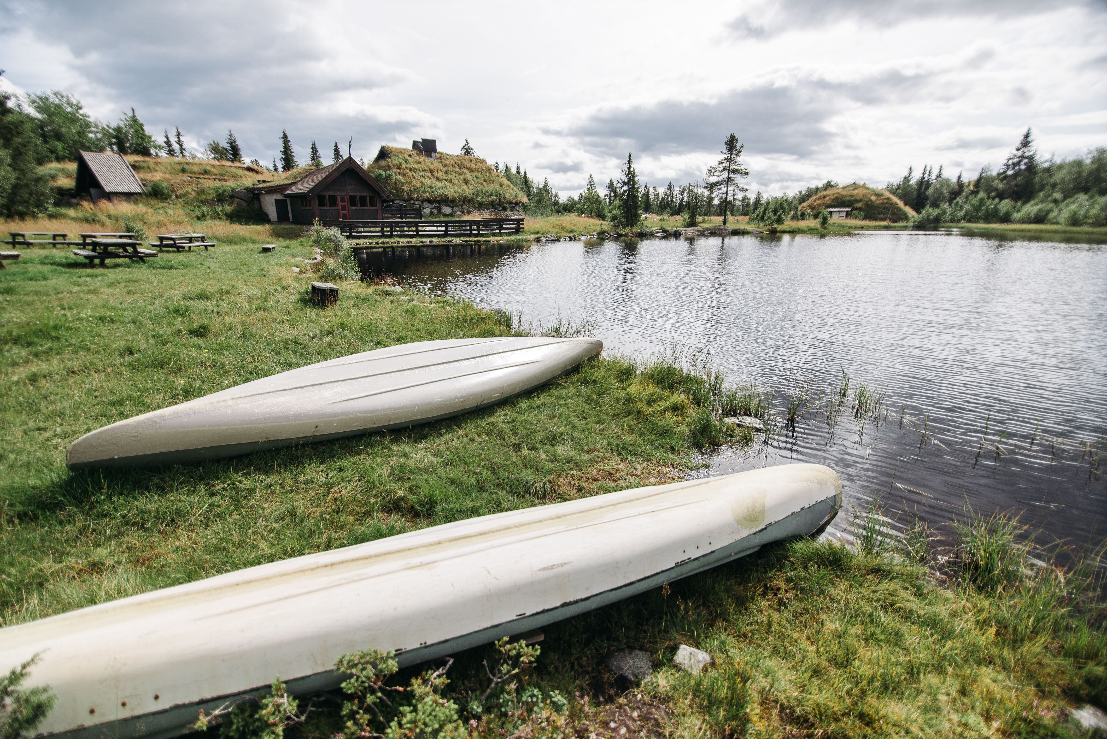 white canoes on the lakeside