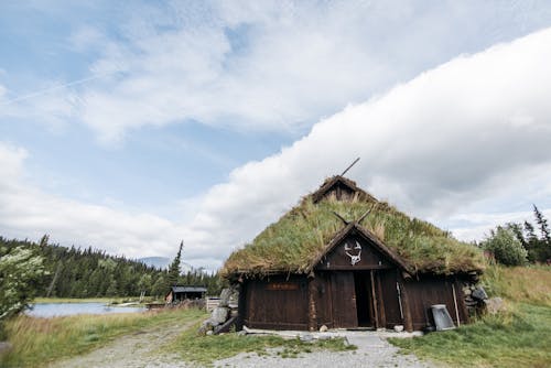 A Wooden Barn on a Farm Field