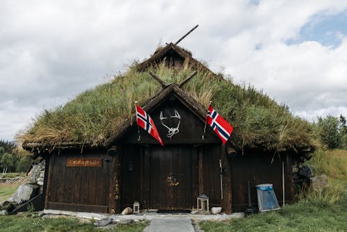 Flags of Norway on a Wooden Barn