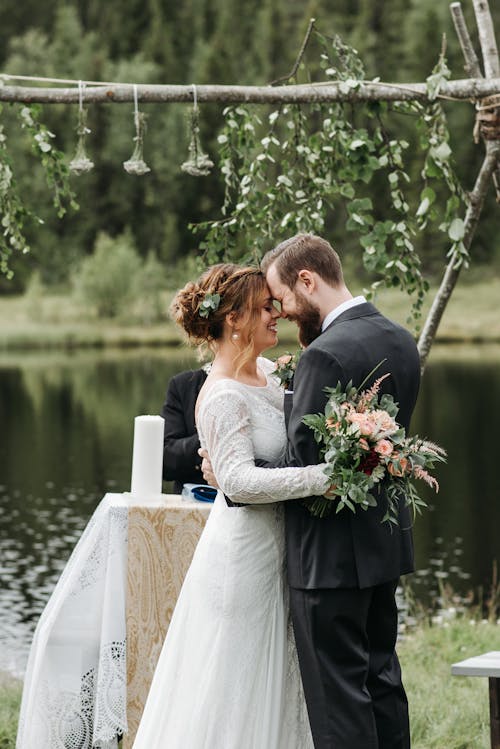 Free Photo of a Romantic Couple Head to Head on Their Wedding Stock Photo