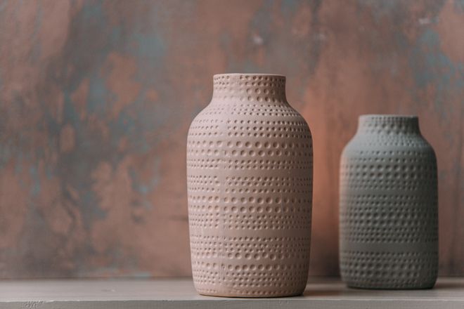 Ceramic vessels on a table — photo by Ivan S on Pexels