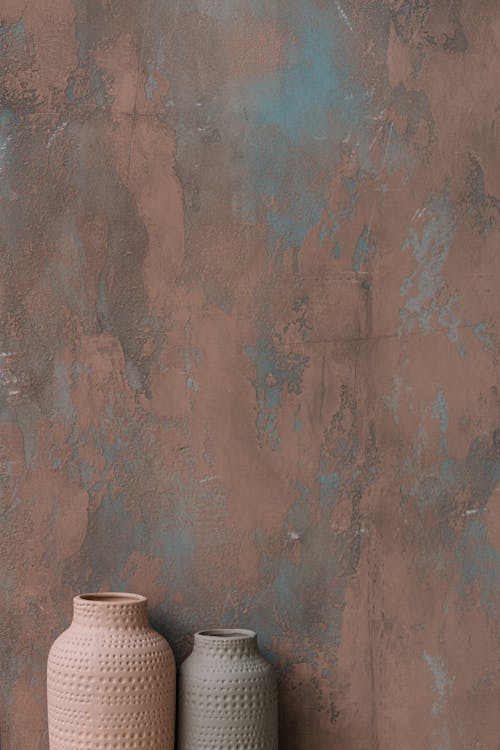 Photograph of Vases Beside a Wall