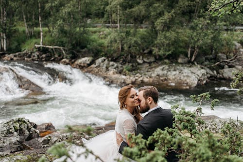 Couple Sitting on Riverbanks