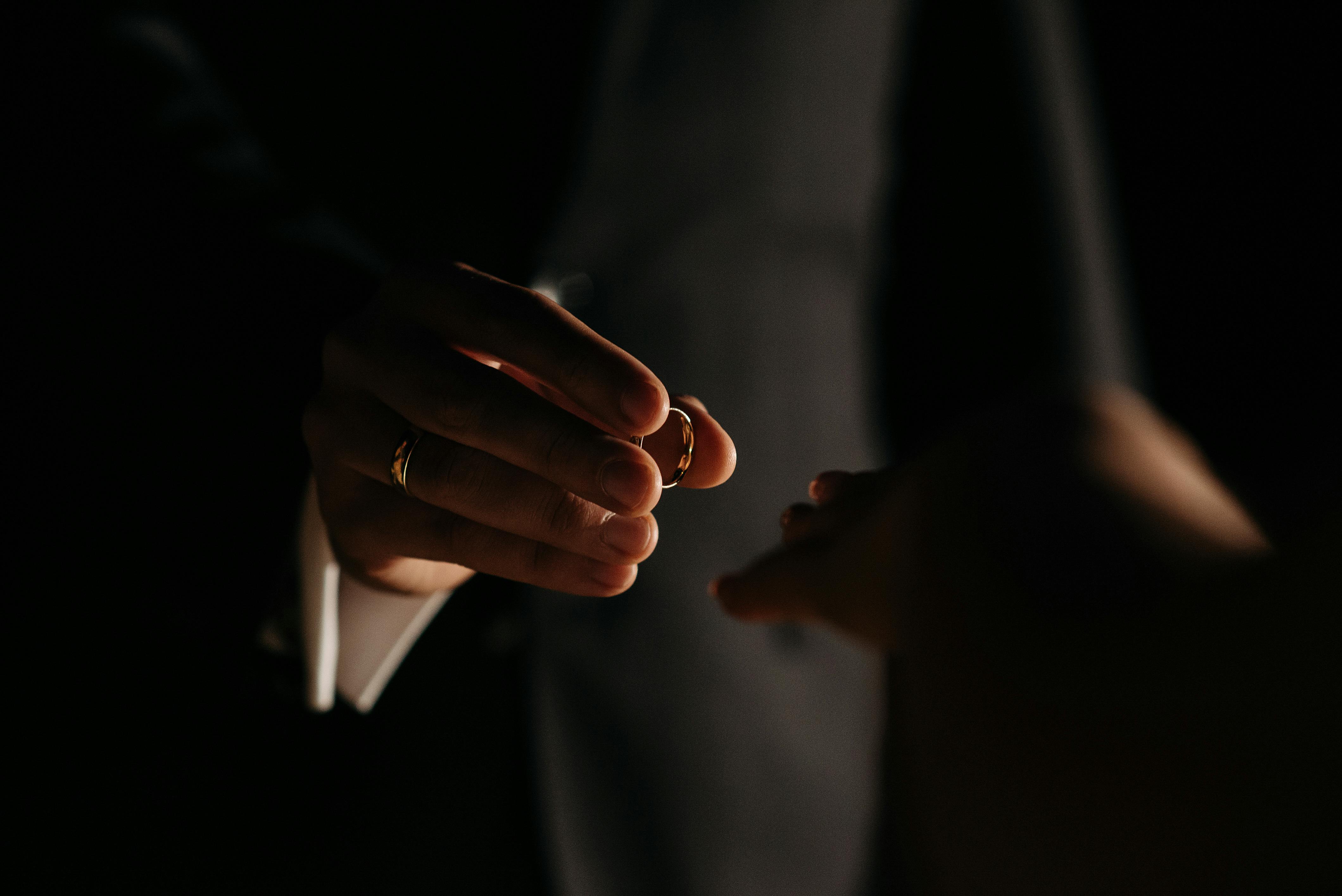 a person holding ring