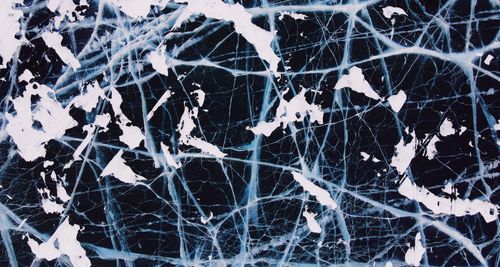 Free A mesmerizing abstract view of a cracked frozen lake in Olkhonsky, Russia. Stock Photo
