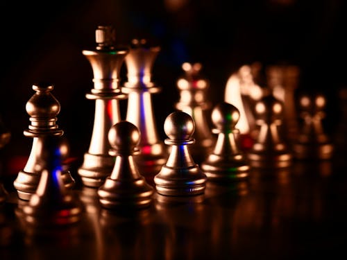 Gold Chess Pieces in Close-Up Photography