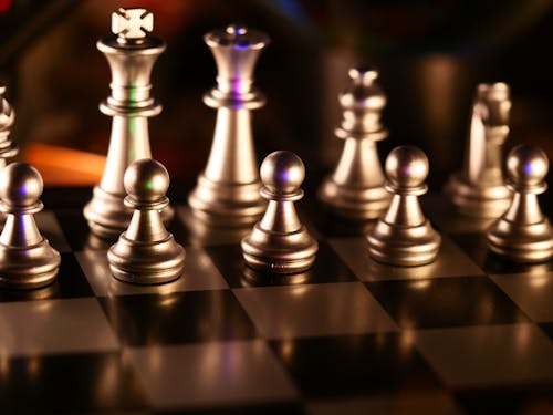 Free Golden Chess Pieces in Close Up Photography Stock Photo