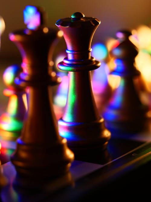 Brown Chess Pieces in Close Up Photography