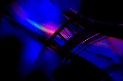 Blue and Pink Neon Light Beside a Black Object