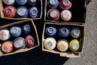 Spray Cans in Boxes