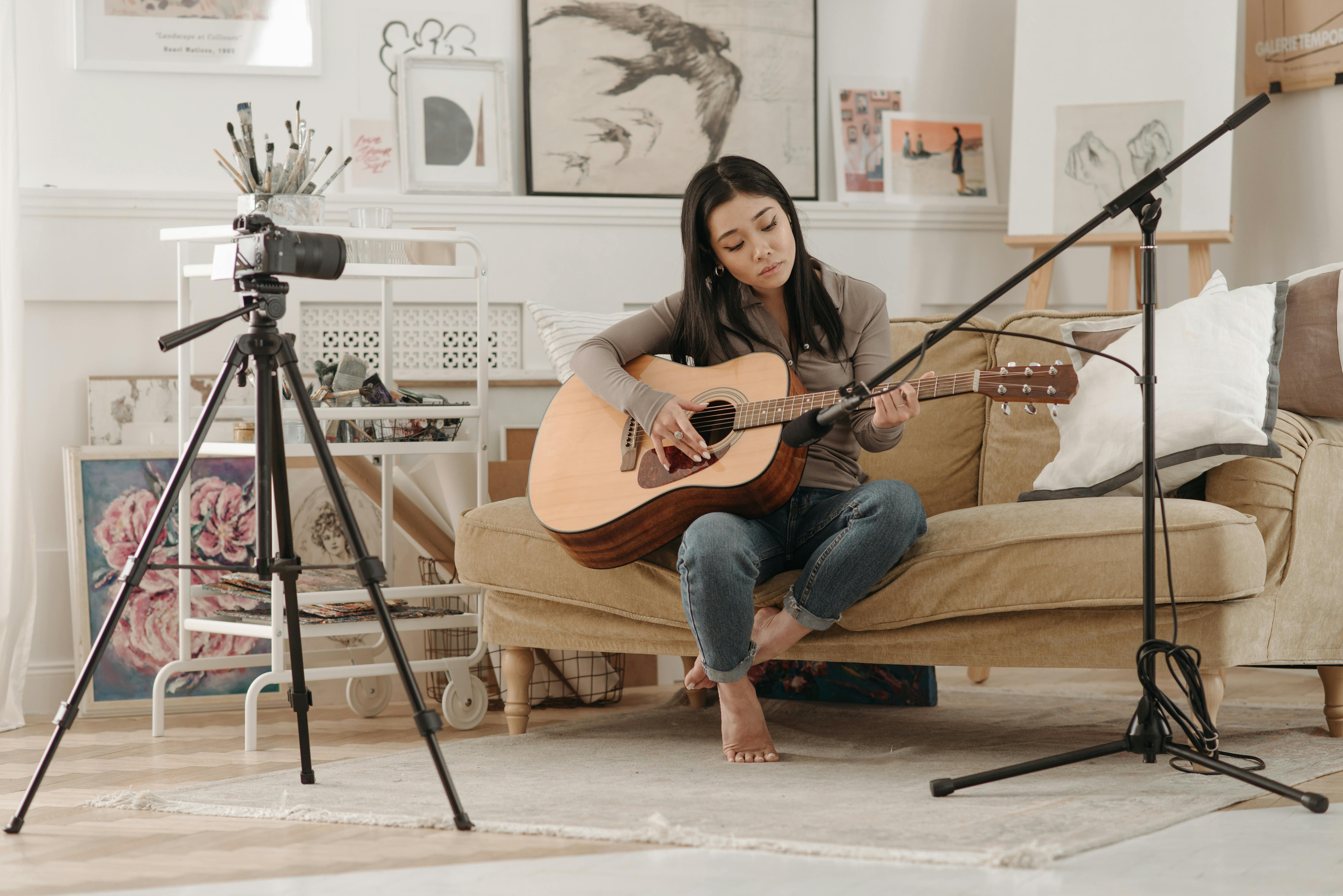 a woman playing guitar