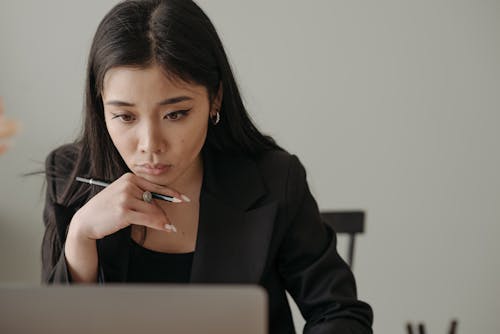 Woman on Black Work Suit Jacket Looking Laptop