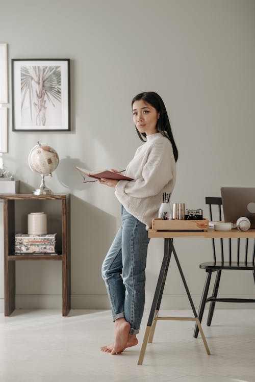 A Woman Holding a Notebook