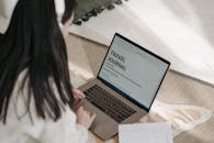 A Person Tying on the Laptop