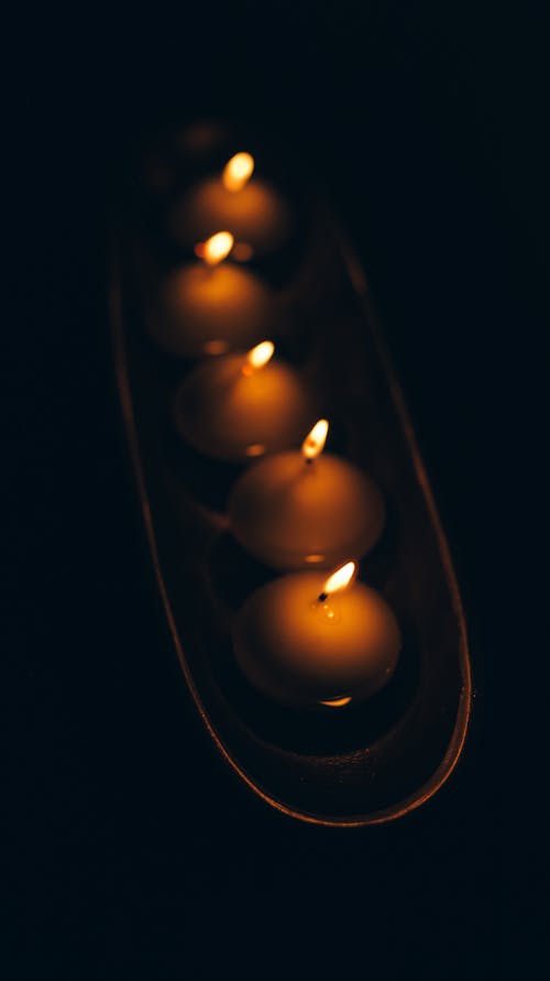 Lighted Candles in Dark Room